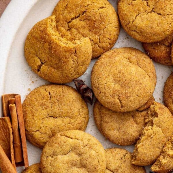 Pumpkin snickerdoodles on a white serving tray.