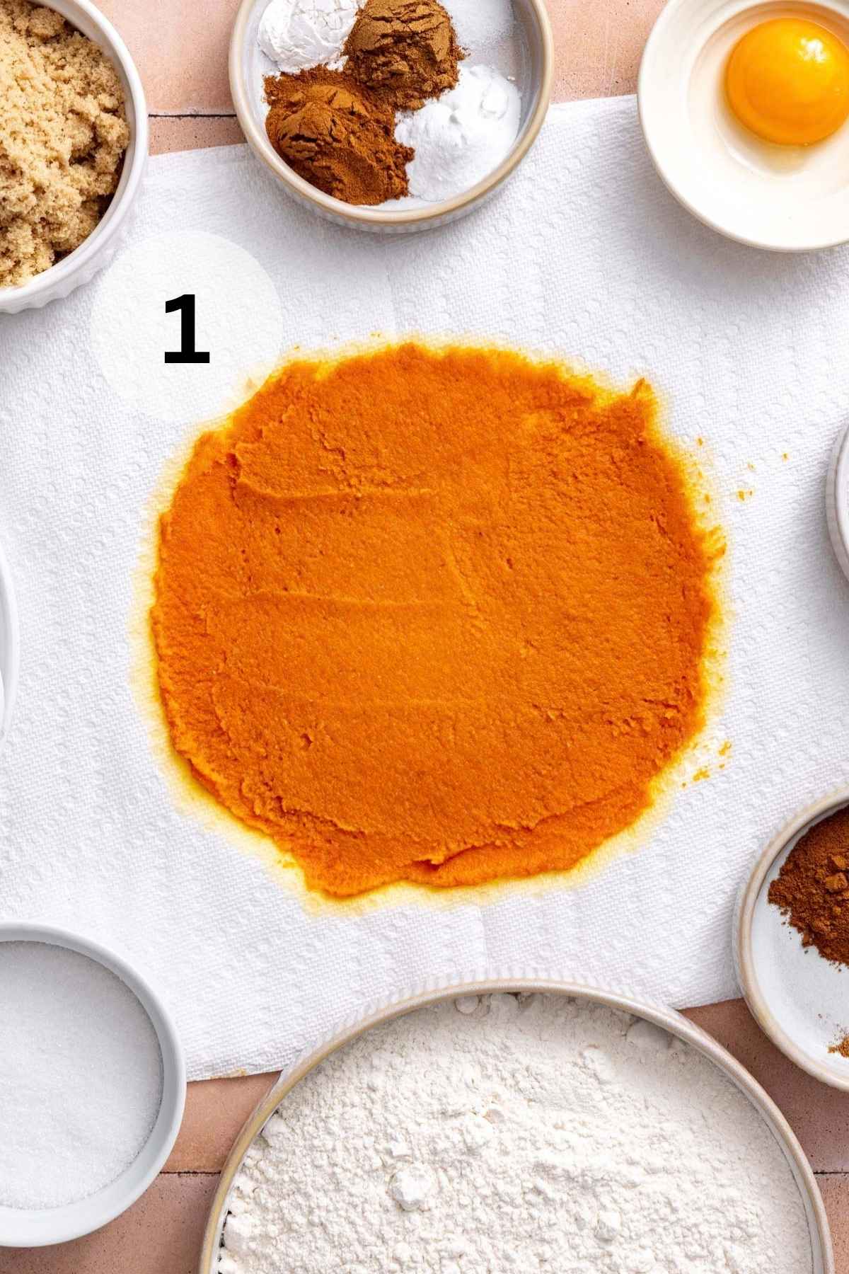 Blotting pumpkin puree on a paper towel.
